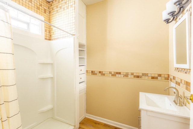 1031 S 15th St, Milwaukee, WI 53204 - full bath with a shower with curtain, vanity, and wood finished floors