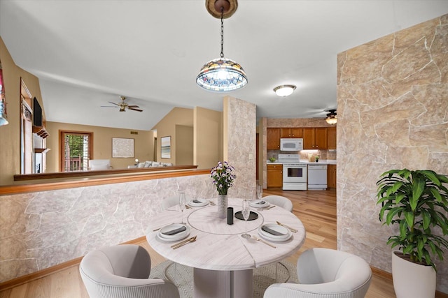 W159N4835 Graysland Dr Unit E, Menomonee Falls, WI 53051 - dining space with ceiling fan, light wood-style flooring, and vaulted ceiling