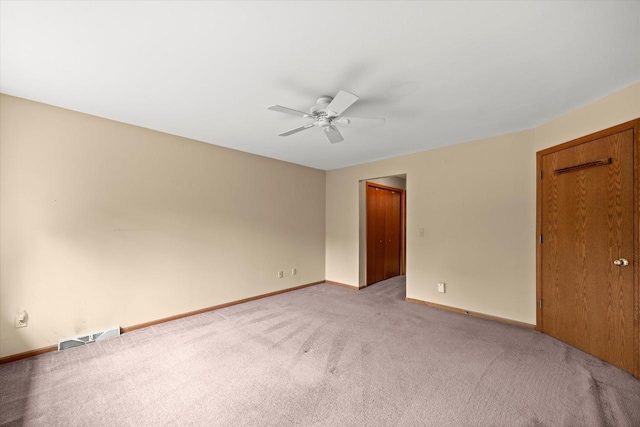 W159N4835 Graysland Dr Unit E, Menomonee Falls, WI 53051 - spare room featuring light colored carpet, a ceiling fan, and baseboards