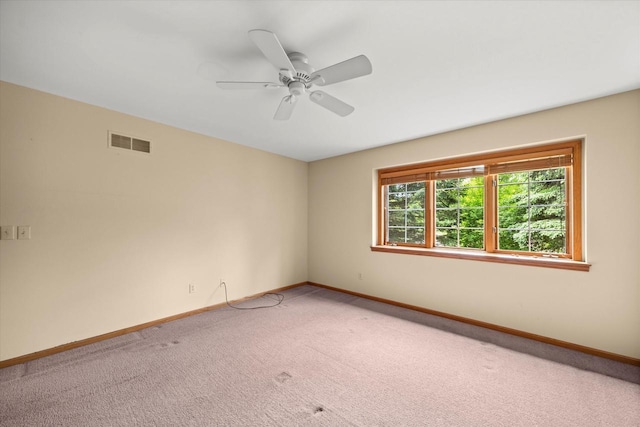 W159N4835 Graysland Dr Unit E, Menomonee Falls, WI 53051 - unfurnished room with light colored carpet, baseboards, and a ceiling fan