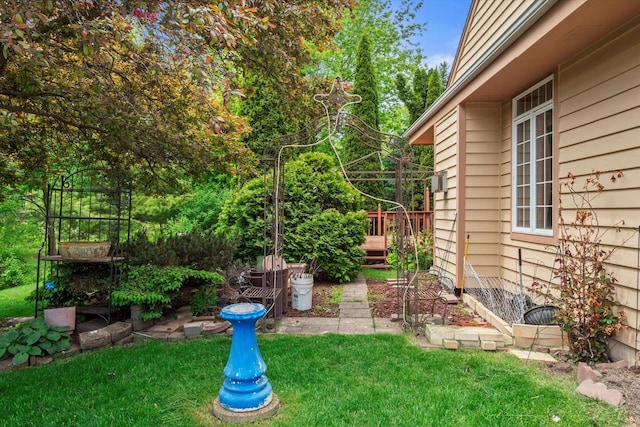 W159N4835 Graysland Dr Unit E, Menomonee Falls, WI 53051 - view of green lawn with a wooden deck