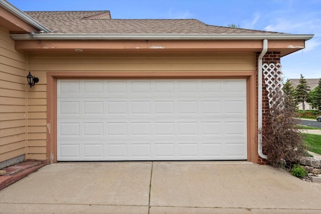 W159N4835 Graysland Dr Unit E, Menomonee Falls, WI 53051 - garage featuring concrete driveway