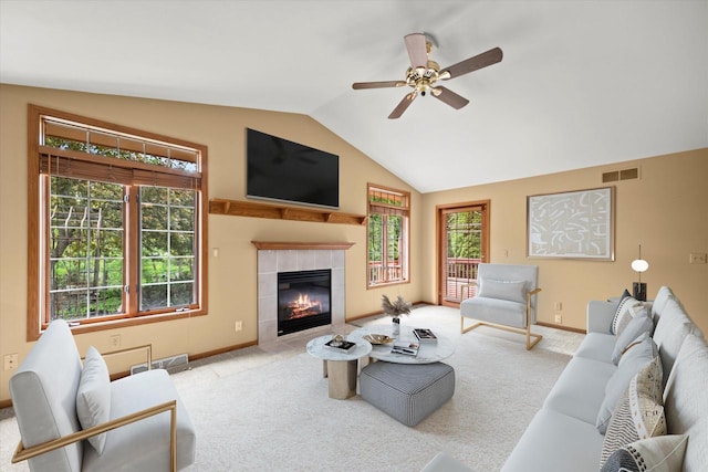 W159N4835 Graysland Dr Unit E, Menomonee Falls, WI 53051 - living room with vaulted ceiling, carpet, ceiling fan, a tile fireplace, and baseboards
