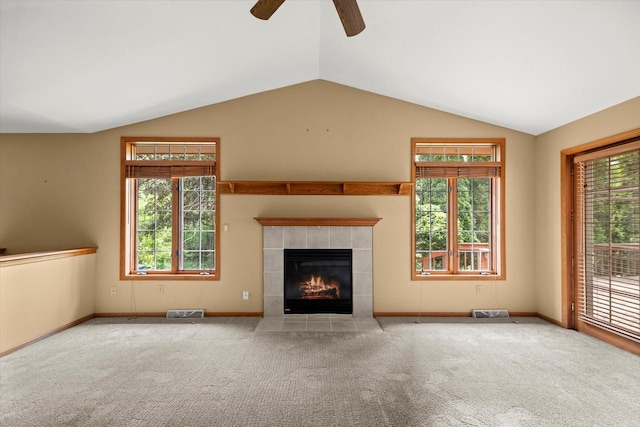 W159N4835 Graysland Dr Unit E, Menomonee Falls, WI 53051 - unfurnished living room with ceiling fan, vaulted ceiling, a tile fireplace, carpet floors, and baseboards
