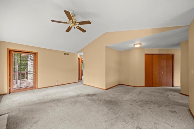 W159N4835 Graysland Dr Unit E, Menomonee Falls, WI 53051 - carpeted empty room featuring lofted ceiling, a ceiling fan, and baseboards