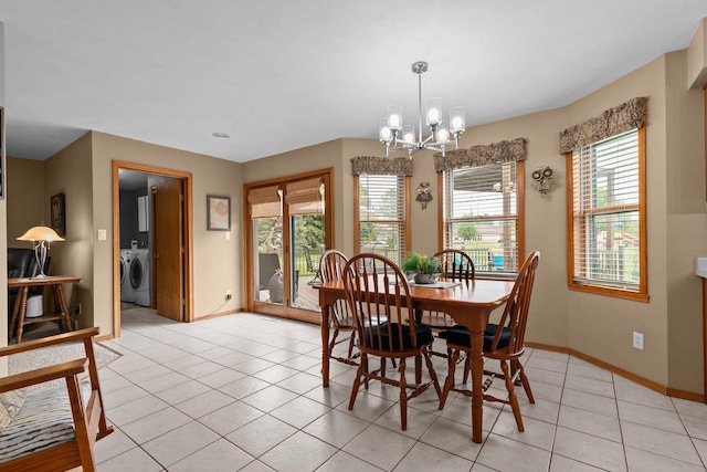 3226 W Twin Willow Ct, Appleton, WI 54914 - dining space with washer / clothes dryer, a chandelier, light tile patterned floors, and baseboards