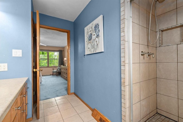 3226 W Twin Willow Ct, Appleton, WI 54914 - bathroom featuring a shower stall, vanity, tile patterned floors, and baseboards