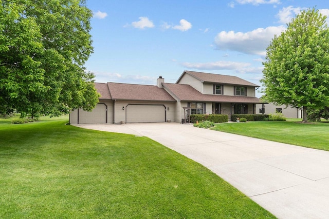 3226 W Twin Willow Ct, Appleton, WI 54914 - view of front facade featuring an attached garage, a front lawn, driveway, and a chimney