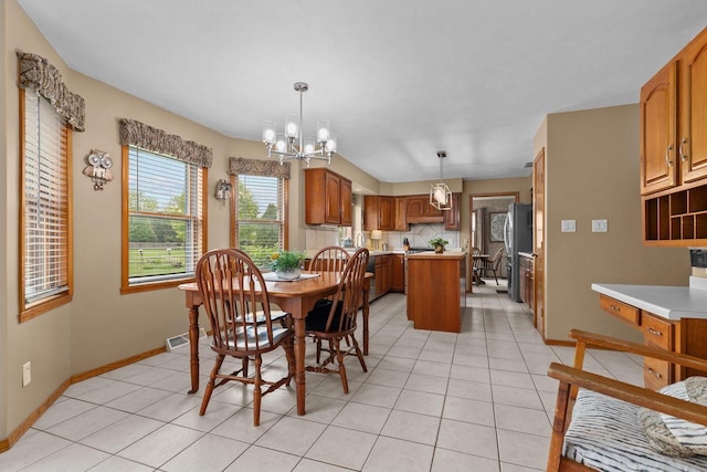 3226 W Twin Willow Ct, Appleton, WI 54914 - dining space featuring a chandelier, light tile patterned floors, and baseboards