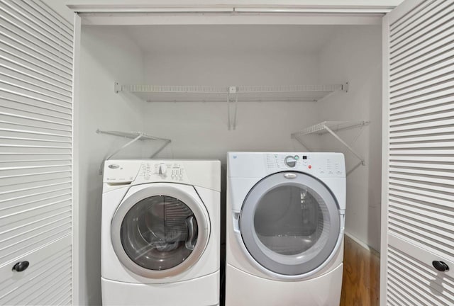 690 Valleyview Ct Unit 35-22, Lake Geneva, WI 53147 - washroom featuring washing machine and dryer and wood finished floors