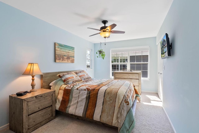 690 Valleyview Ct Unit 35-22, Lake Geneva, WI 53147 - carpeted bedroom with baseboards and ceiling fan