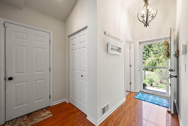 690 Valleyview Ct Unit 35-22, Lake Geneva, WI 53147 - entryway featuring wood finished floors, baseboards, and a chandelier