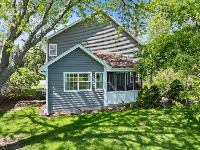 690 Valleyview Ct Unit 35-22, Lake Geneva, WI 53147 - rear view of property with cooling unit, a lawn, a sunroom, and a shingled roof