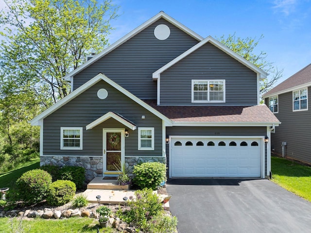 690 Valleyview Ct Unit 35-22, Lake Geneva, WI 53147 - view of front of property with driveway, an attached garage, and a shingled roof