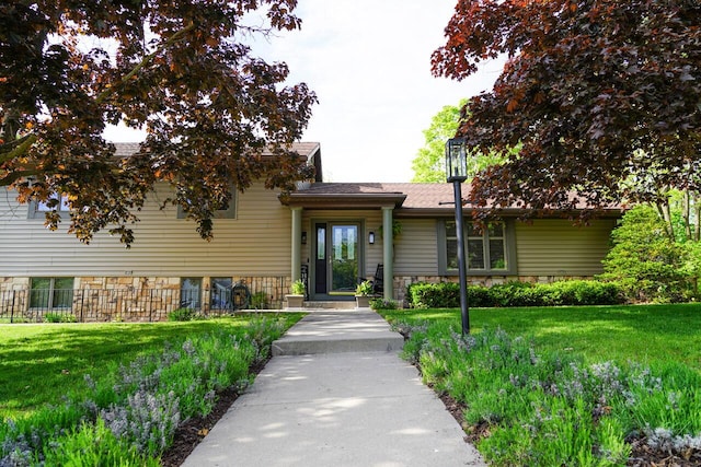 600 Briody St, Burlington, WI 53105 - view of front of property featuring stone siding and a front lawn