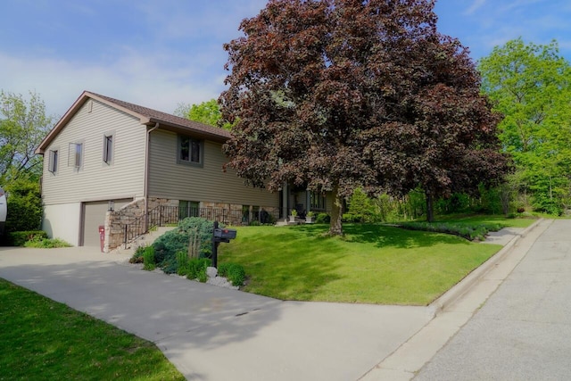 600 Briody St, Burlington, WI 53105 - view of front of property with a garage, a front yard, and concrete driveway