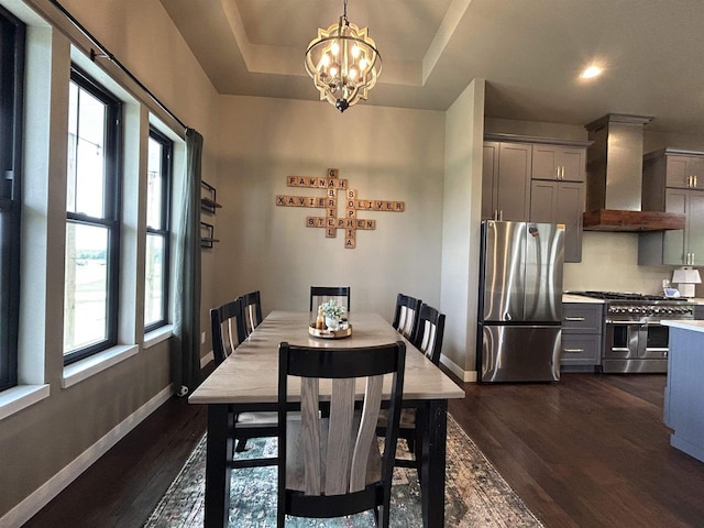 11654 Flambeau Rd, Tomah, WI 54660 - dining room with a chandelier, dark wood finished floors, and baseboards