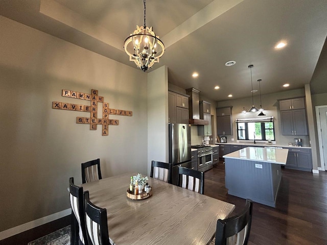 11654 Flambeau Rd, Tomah, WI 54660 - dining area featuring a chandelier, recessed lighting, dark wood-style floors, and baseboards