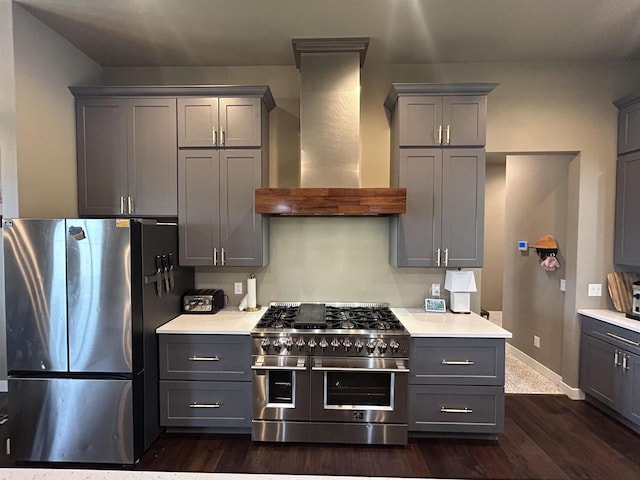 11654 Flambeau Rd, Tomah, WI 54660 - kitchen featuring stainless steel appliances, gray cabinetry, wall chimney exhaust hood, and light countertops