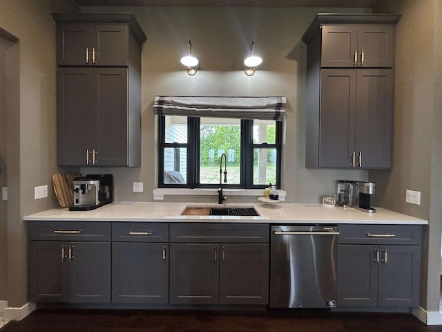 11654 Flambeau Rd, Tomah, WI 54660 - kitchen featuring stainless steel dishwasher, a sink, light countertops, and gray cabinets