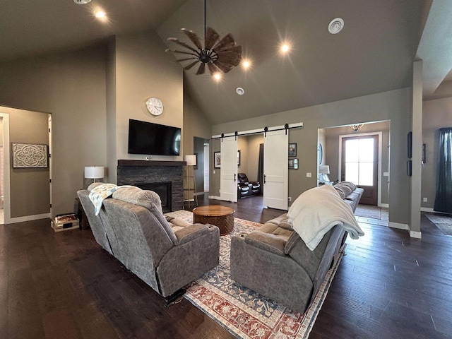 11654 Flambeau Rd, Tomah, WI 54660 - living room with a barn door, high vaulted ceiling, baseboards, ceiling fan, and wood finished floors
