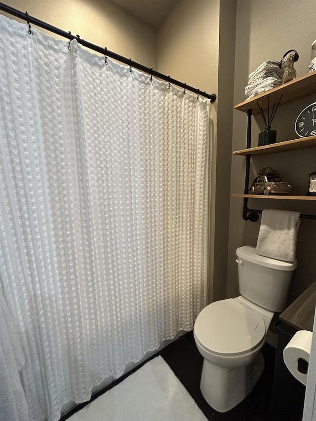 11654 Flambeau Rd, Tomah, WI 54660 - full bathroom featuring toilet, a shower with curtain, and tile patterned floors