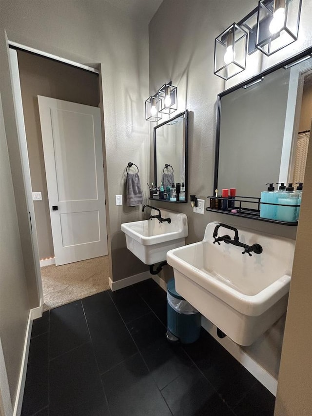 11654 Flambeau Rd, Tomah, WI 54660 - bathroom featuring baseboards, a sink, and tile patterned flooring