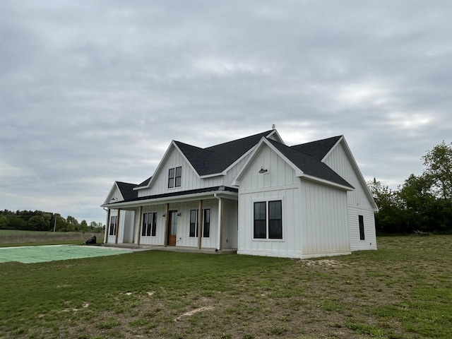 11654 Flambeau Rd, Tomah, WI 54660 - modern farmhouse style home with board and batten siding and a front lawn