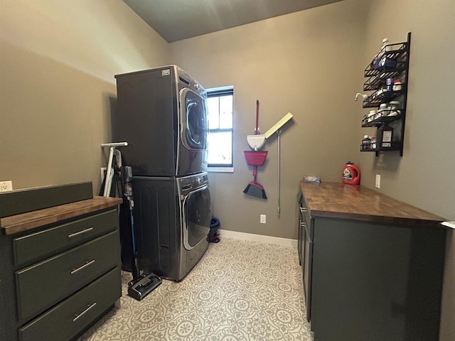 11654 Flambeau Rd, Tomah, WI 54660 - laundry area featuring estacked washer and dryer and baseboards
