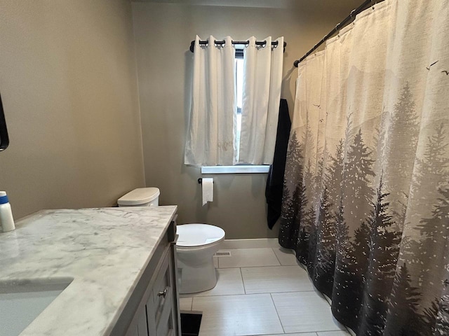 11654 Flambeau Rd, Tomah, WI 54660 - full bathroom featuring vanity, tile patterned floors, toilet, baseboards, and curtained shower
