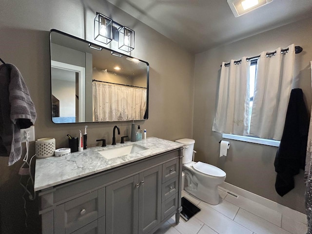 11654 Flambeau Rd, Tomah, WI 54660 - bathroom with vanity, toilet, tile patterned flooring, baseboards, and curtained shower