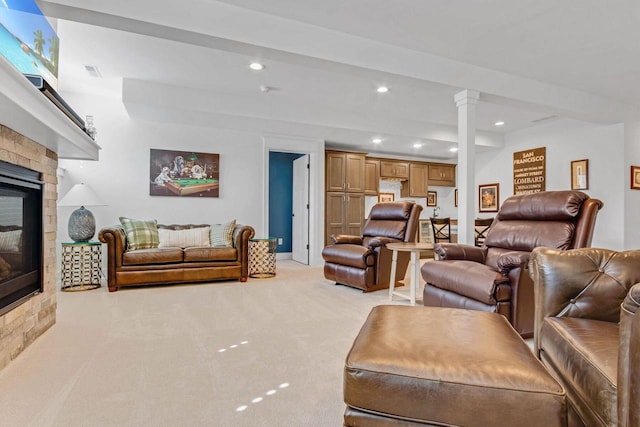 833 Red Hawk Dr, Walworth, WI 53184 - living area with a glass covered fireplace, recessed lighting, light colored carpet, and ornate columns
