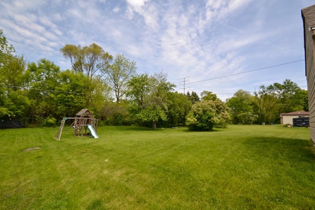 10432 W Manor Park Dr, West Allis, WI 53227 - view of grassy yard with a playground and view of scattered trees