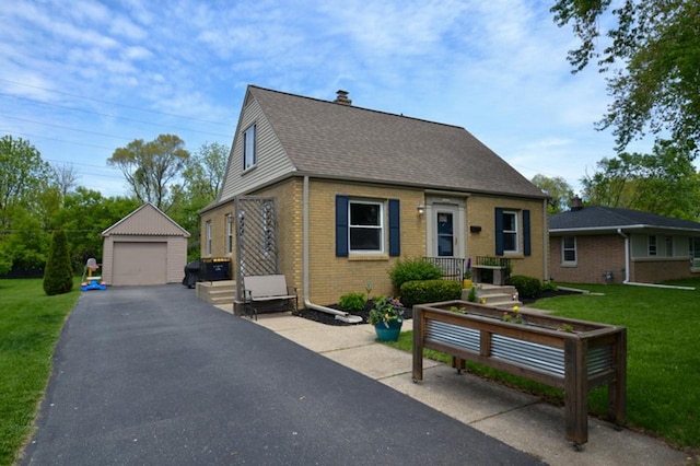 10432 W Manor Park Dr, West Allis, WI 53227 - new england style home with a garage, an outdoor structure, brick siding, a shingled roof, and a chimney