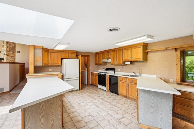 1510 County Road Qq, Mineral Point, WI 53565 - kitchen with white appliances, a peninsula, under cabinet range hood, and a sink