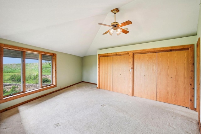 1510 County Road Qq, Mineral Point, WI 53565 - unfurnished bedroom with vaulted ceiling, light carpet, baseboards, ceiling fan, and multiple closets