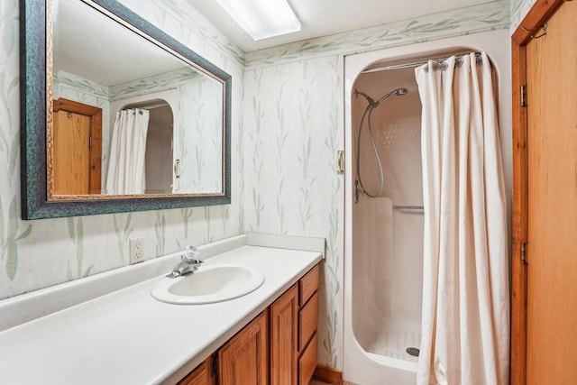 1510 County Road Qq, Mineral Point, WI 53565 - bathroom with wallpapered walls, a stall shower, and vanity
