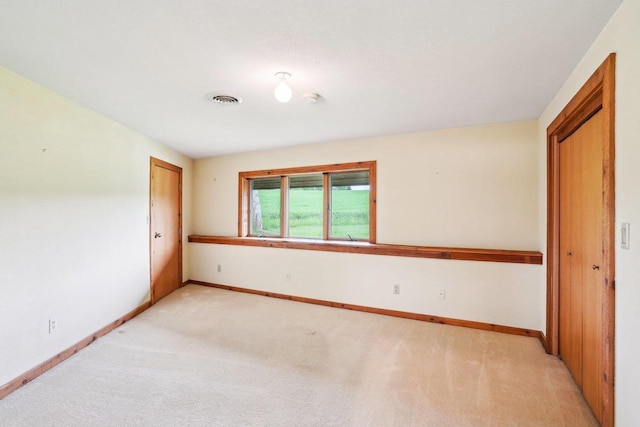 1510 County Road Qq, Mineral Point, WI 53565 - spare room featuring light colored carpet, baseboards, and a smoke detector