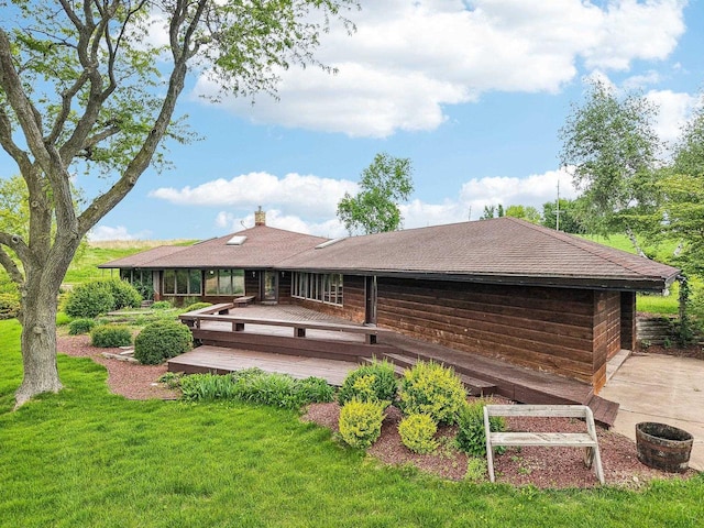1510 County Road Qq, Mineral Point, WI 53565 - rear view of house with a lawn, a deck, and a chimney