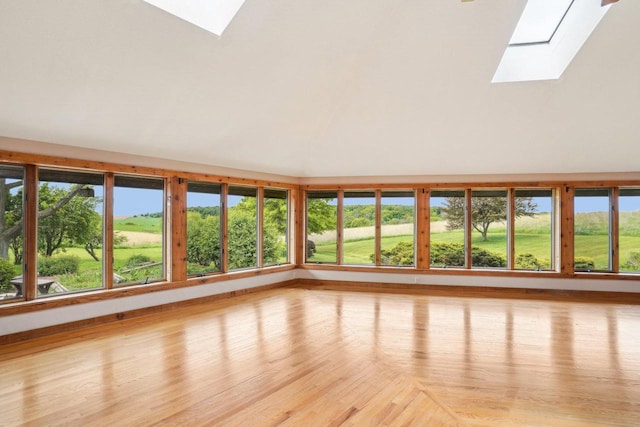 1510 County Road Qq, Mineral Point, WI 53565 - unfurnished sunroom featuring a skylight, vaulted ceiling, and healthy amount of natural light
