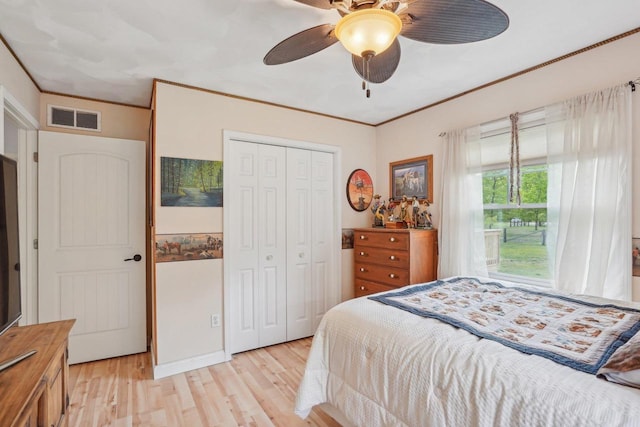 354 Pine Ct, Muscoda, WI 53573 - bedroom featuring light wood finished floors, a closet, a ceiling fan, and ornamental molding