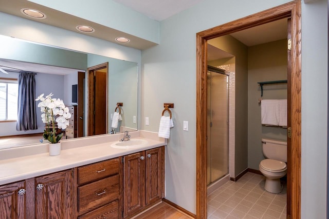 7423 Cedar Creek Trl, Madison, WI 53717 - full bath featuring toilet, vanity, a stall shower, baseboards, and recessed lighting