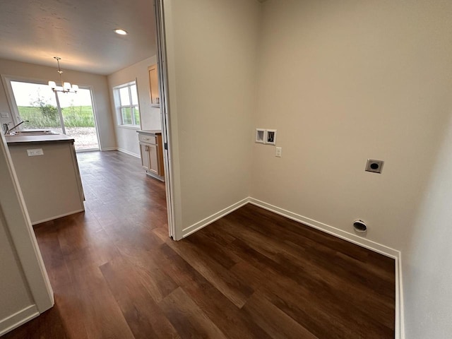 959 Sully Way, Sheboygan Falls, WI 53085 - laundry area featuring hookup for an electric dryer, hookup for a washing machine, a chandelier, baseboards, and dark wood finished floors