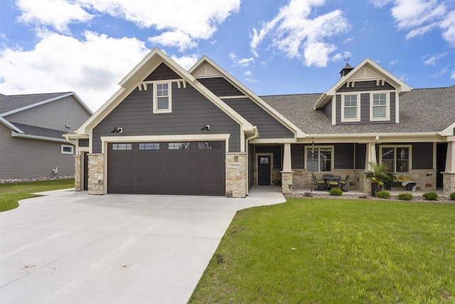 W4949 Cottage Ln, Sherwood, WI 54169 - craftsman inspired home with stone siding, driveway, a front lawn, and covered porch