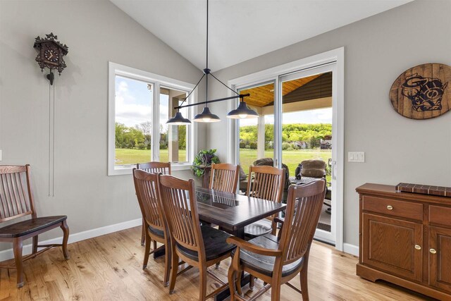 W4949 Cottage Ln, Sherwood, WI 54169 - dining room with healthy amount of natural light, lofted ceiling, light wood-style flooring, and baseboards