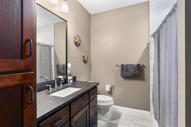 W4949 Cottage Ln, Sherwood, WI 54169 - bathroom with vanity, toilet, baseboards, and a shower with shower curtain
