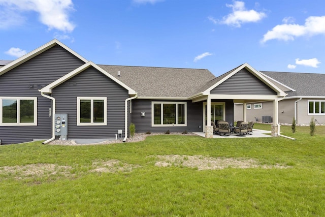 W4949 Cottage Ln, Sherwood, WI 54169 - back of house with a patio, a lawn, cooling unit, and roof with shingles