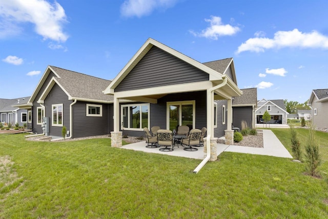 W4949 Cottage Ln, Sherwood, WI 54169 - back of property featuring a patio, a yard, and roof with shingles