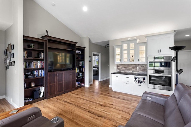 W4949 Cottage Ln, Sherwood, WI 54169 - living room featuring baseboards, light wood-style flooring, lofted ceiling, and recessed lighting