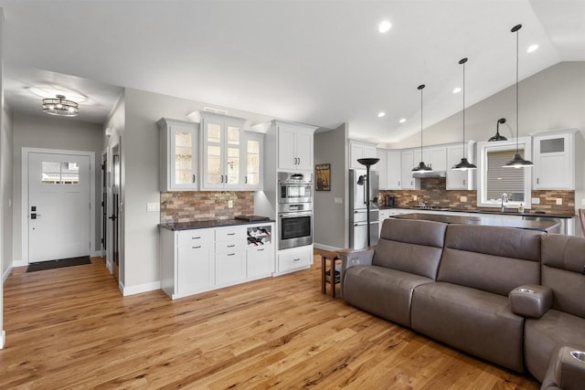 W4949 Cottage Ln, Sherwood, WI 54169 - living area with light wood finished floors, lofted ceiling, recessed lighting, and baseboards